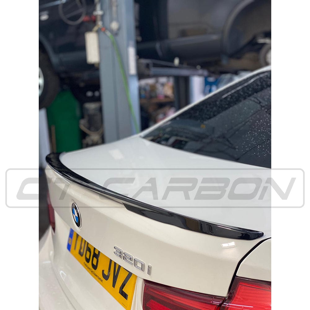 BMW 3 Series F30 CT Carbon gloss black full kit with twin exhaust outlets, featuring MP style design on the rear of the vehicle.