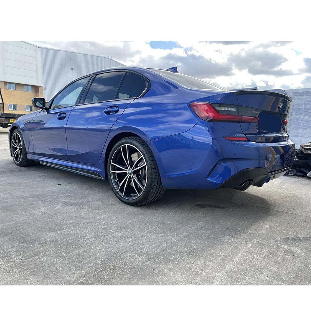 BMW 3 Series G20 gloss black full kit by CT Carbon with round exhaust tips, designed for a sleek, custom look.