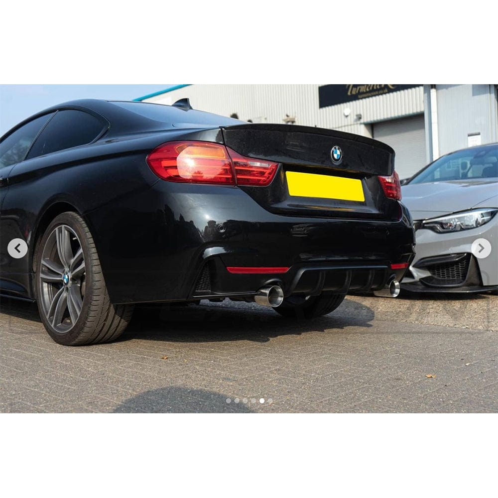 BMW 4 Series F36 2013-2020 CT Carbon gloss black full kit with dual exhaust exits, showcasing the stylish car modification.
