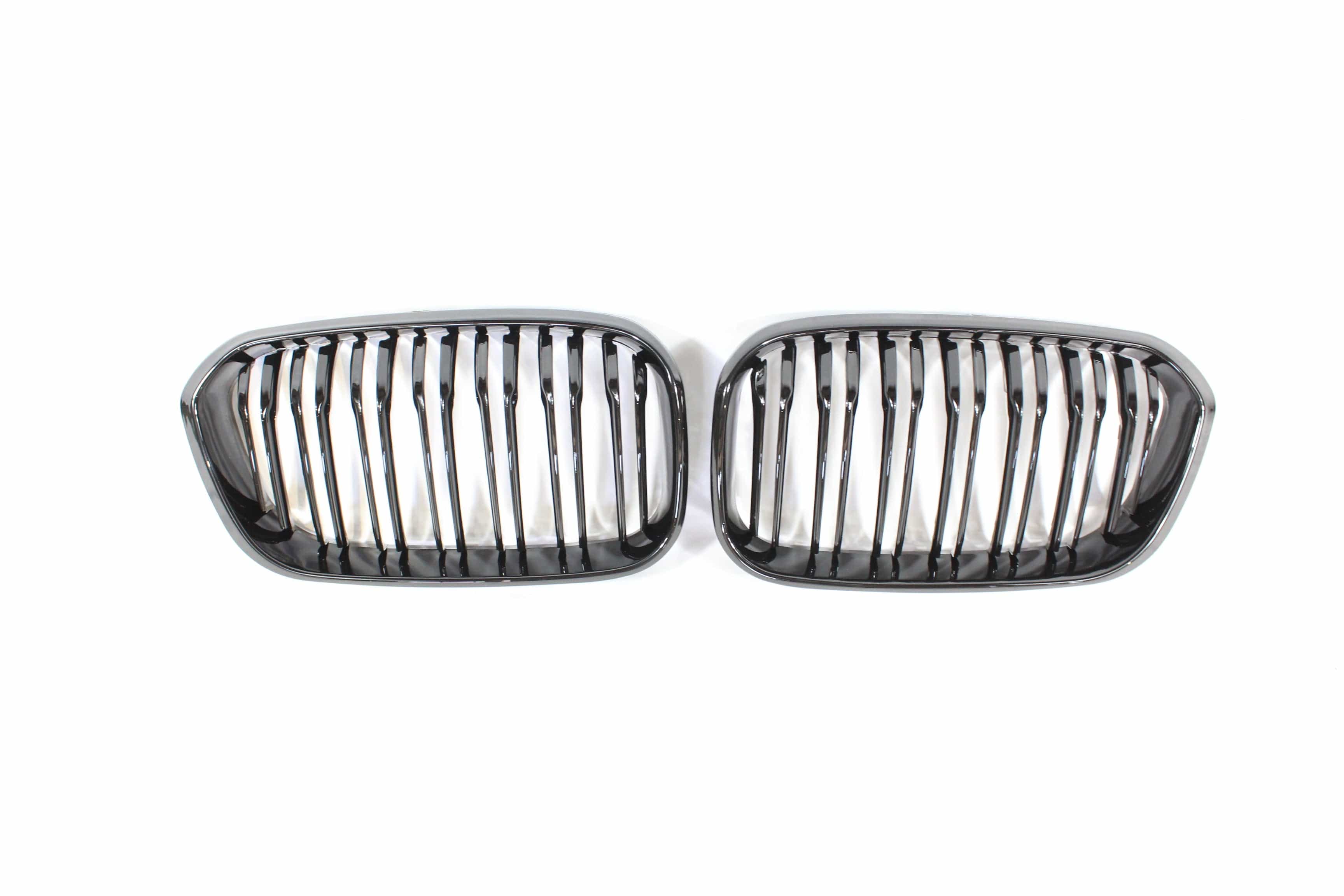 BMW F20 1 Series LCI double slat gloss black grille by CT Carbon, showcasing sleek black finish and grille design.