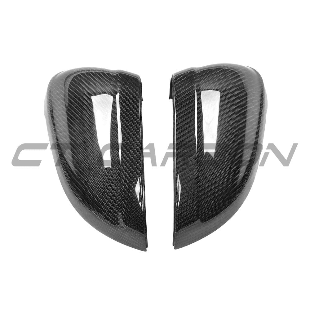 Black carbon fiber mirror replacements for Audi A4, S4, A5, S5 B9 models, by CT Carbon, showing sleek, aerodynamic mirror covers.