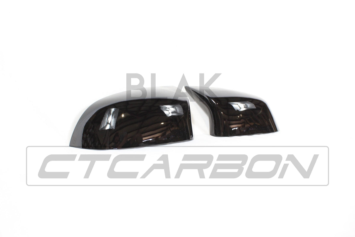 Gloss black mirror replacements for BMW F15/F16 X5/X6 by CT Carbon, showcasing sleek, high-quality exterior accessories.