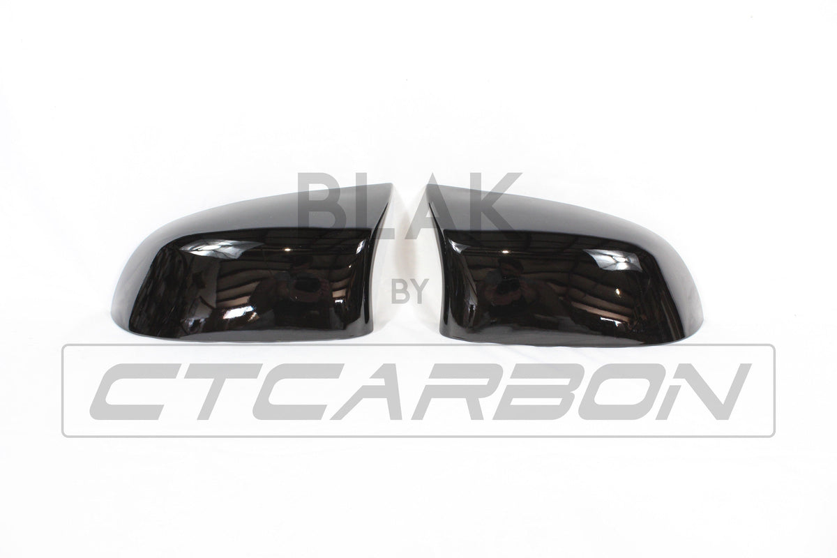 Gloss black BMW F15 F16 X5 X6 mirror replacements by CT Carbon, showing sleek exterior side mirrors with a glossy finish.