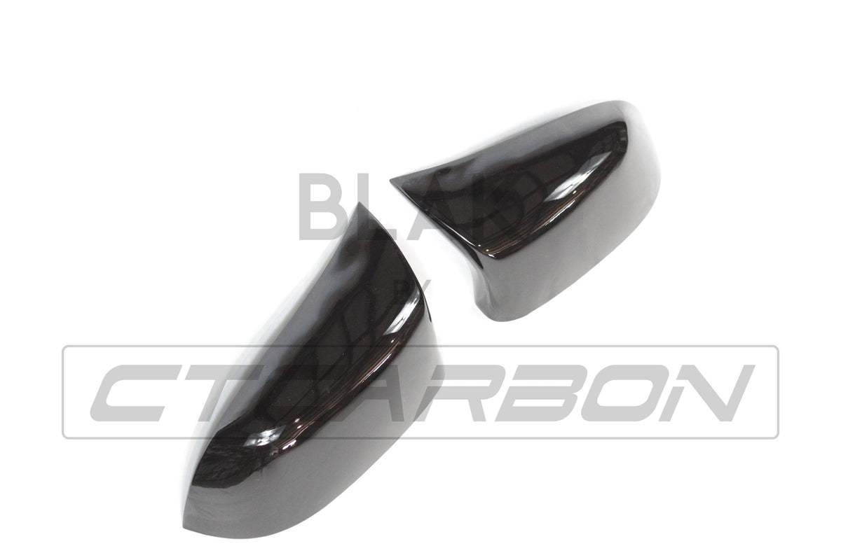 Gloss black mirror replacements for BMW F15/F16 X5/X6 from CT Carbon, showcasing sleek exterior mirror covers.