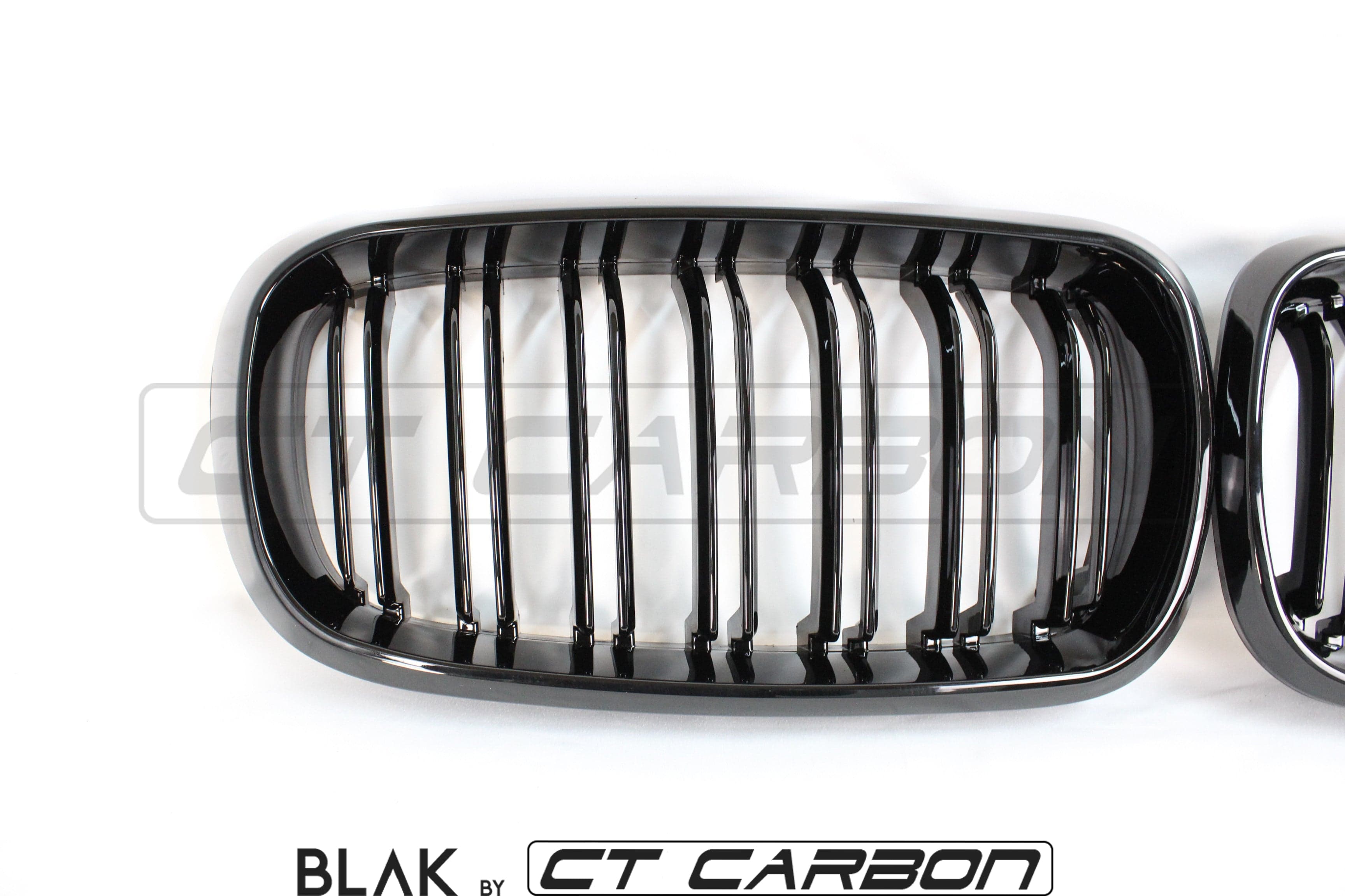 Black CT Carbon double slat grille for BMW X5M F15 and X6M F16 models, featuring sleek design and high-quality finish.