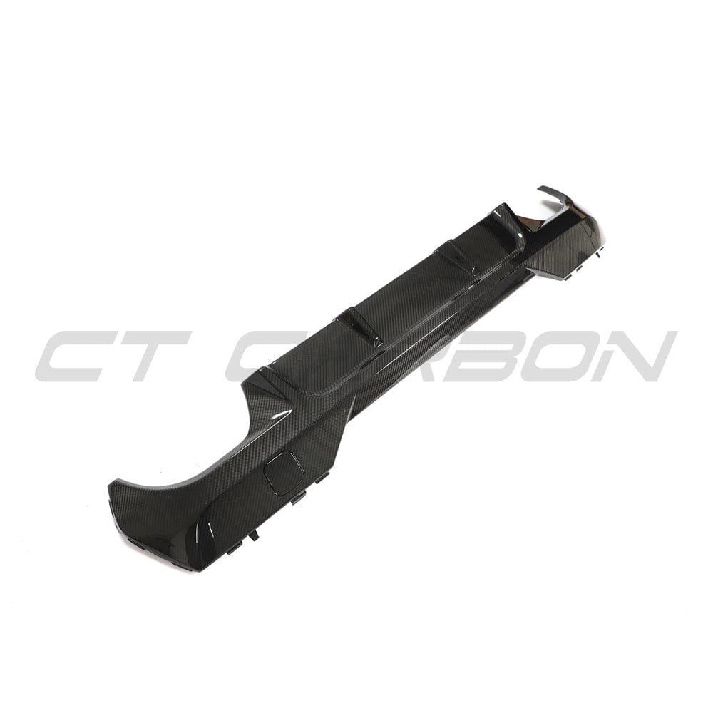 Black BMW G23 4 Series convertible carbon fibre diffuser kit by CT Carbon installed on rear of the car.