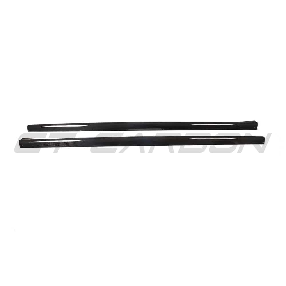 BMW 4 Series G22/G23 carbon fiber side skirts by CT Carbon, sleek black finish, enhances sporty look and aerodynamics.
