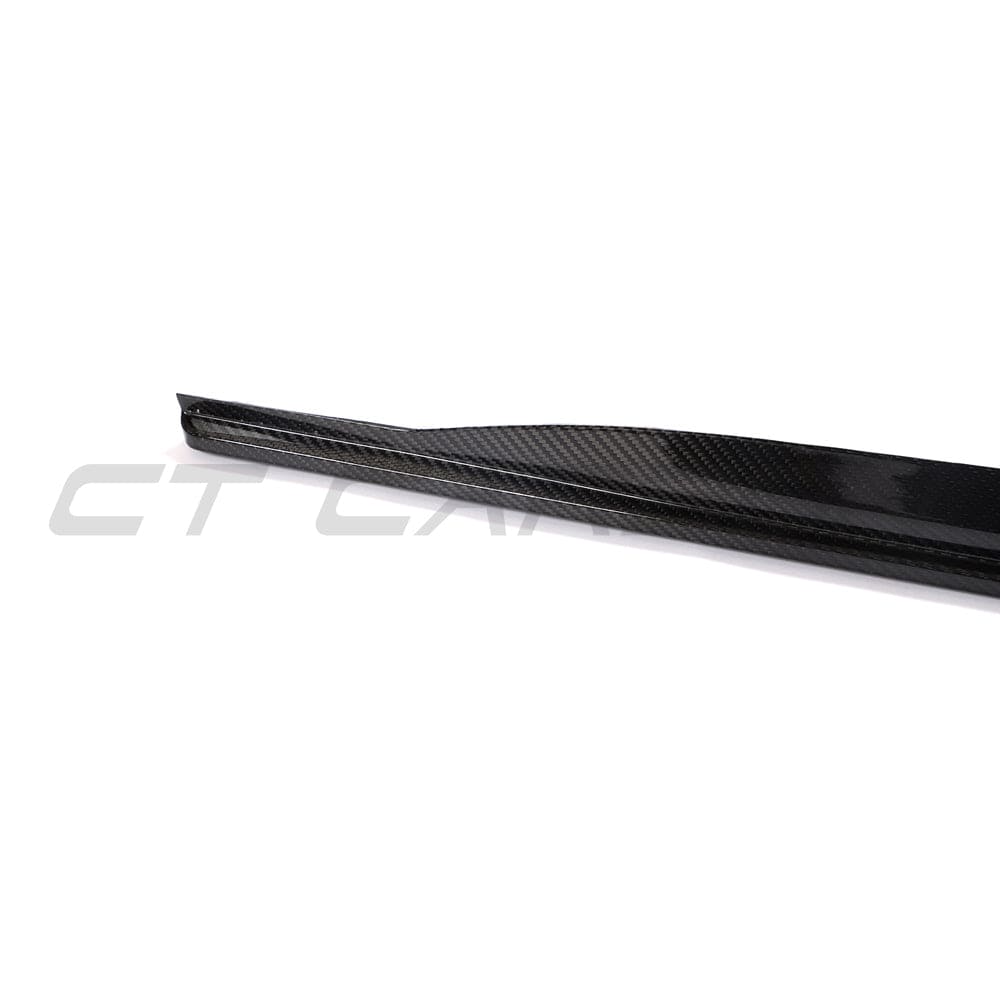 BMW 4 Series G22/G23 Carbon Fibre Side Skirts by CT Carbon, close-up of sleek, black side skirts on a sports car.