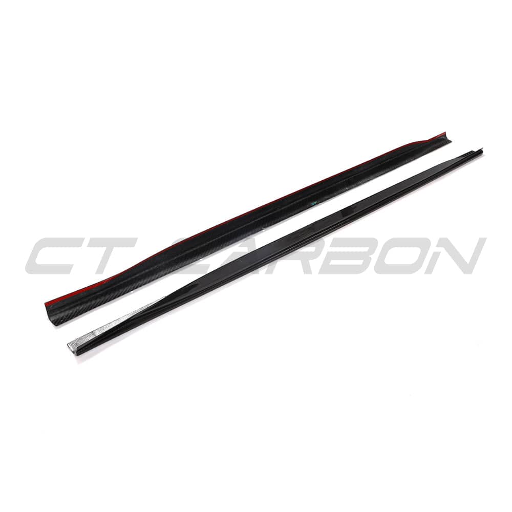 Black BMW G23 4 Series convertible with CT Carbon side skirts and carbon fiber diffuser, showcasing sporty car modifications.