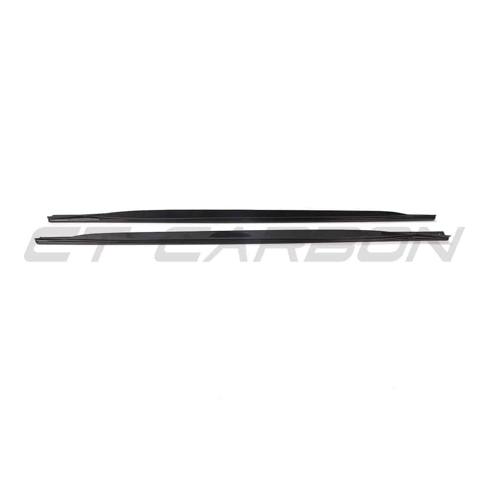 Black BMW G23 4 Series convertible with CT Carbon side skirts and carbon fiber diffuser, showcasing sporty car modifications.