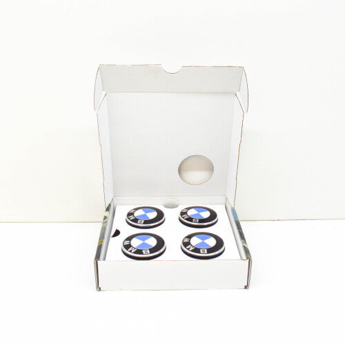 Genuine BMW floating wheel center hub cap set for G30, G20, F48 models, with BMW logo and silver finish on a vehicle wheel