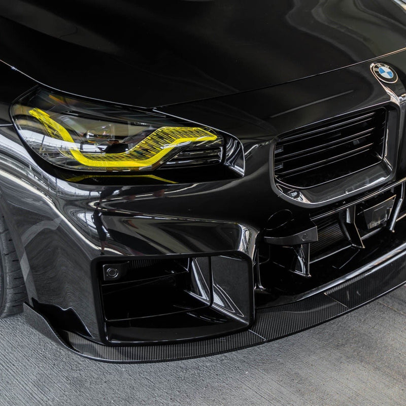 BMW G87 M2 TR87 carbon fibre front splitter with winglets by TREVORA, showcasing sleek aerodynamic design for 2023 model.