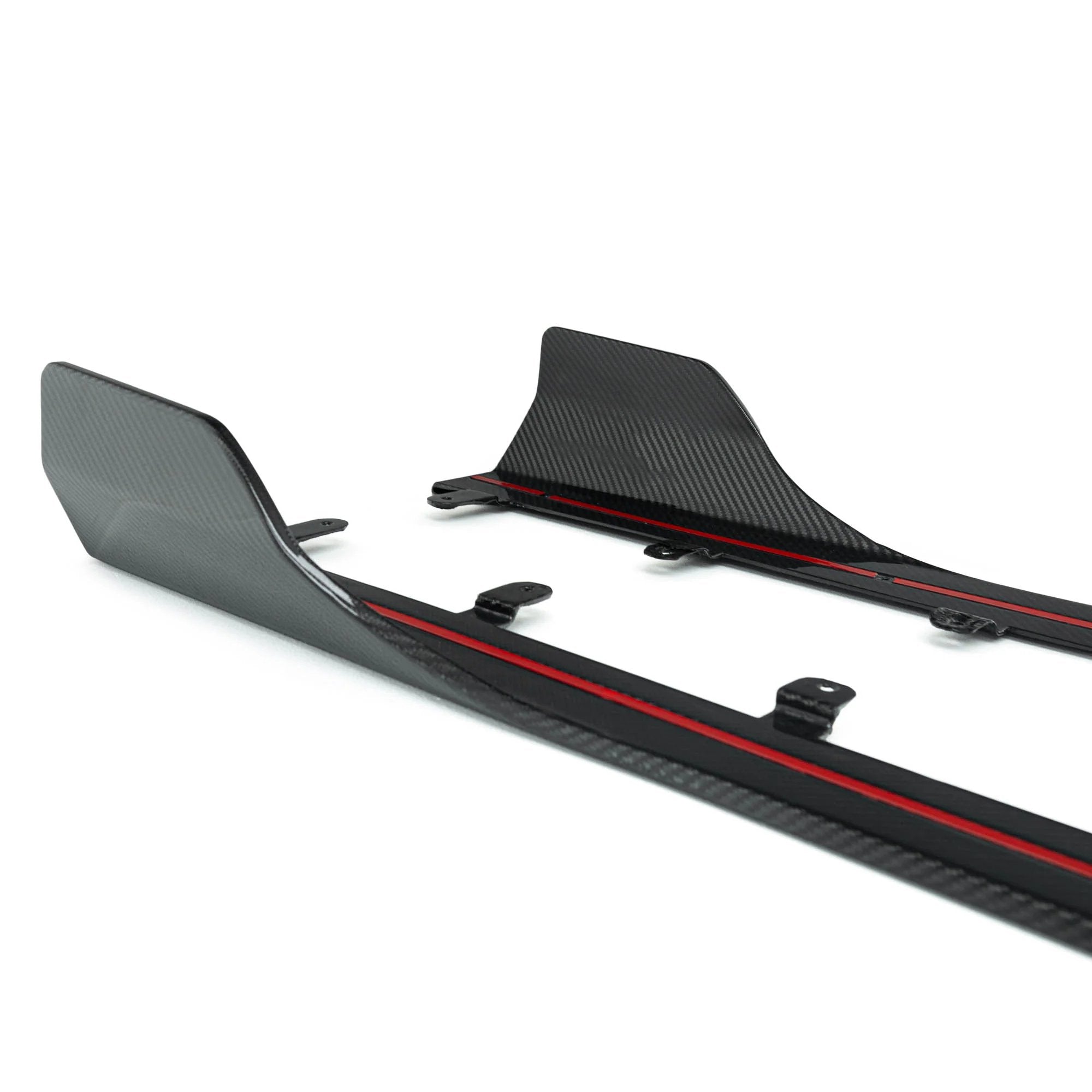 BMW G87 M2 TR87 carbon fibre side skirts by TREVORA, showcasing sleek pre-preg carbon fiber with aerodynamic design.