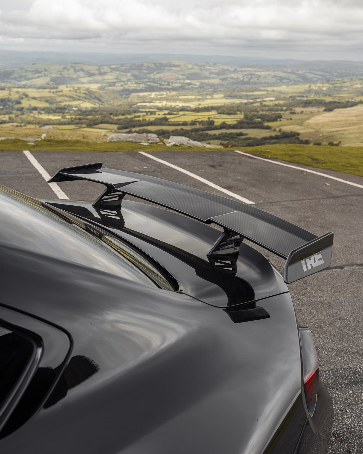 BMW M2 G87 and M240i G42 TREVORA carbon fiber rear wing spoiler, showcasing its sleek, aerodynamic design and lightweight construction.