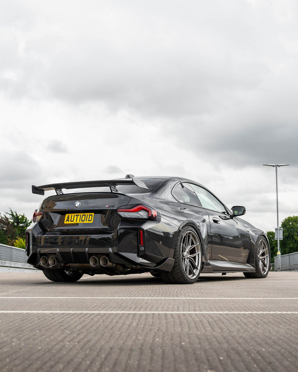 BMW M2 G87 and M240i G42 TREVORA carbon fibre rear wing spoiler, lightweight and aerodynamic, shown on the vehicle in a close-up shot.