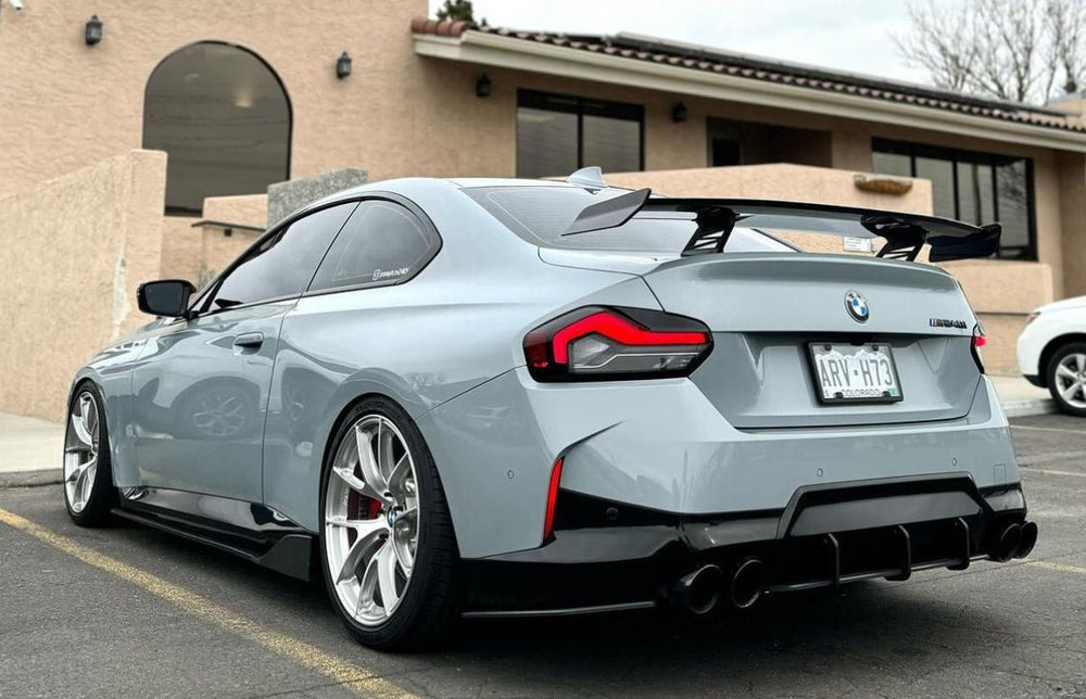 BMW M2 G87 and M240i G42 TREVORA pre-preg carbon fibre rear wing spoiler, showcasing its sleek aerodynamic design and finish.