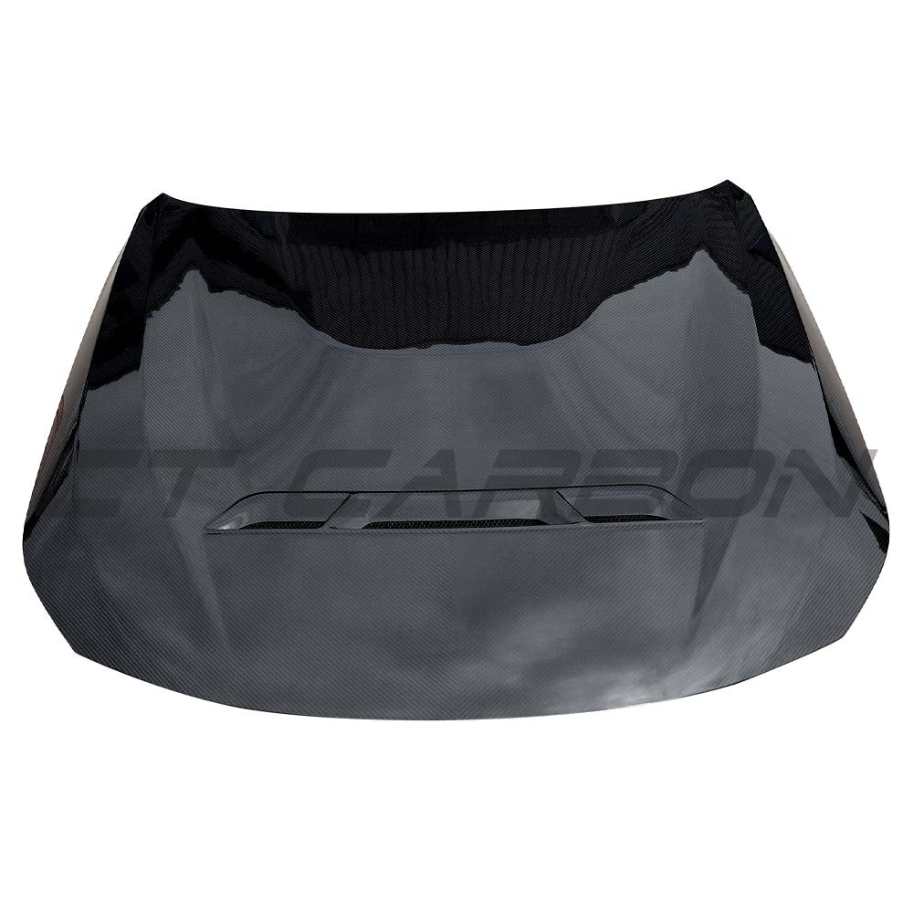 BMW G87 M2 full carbon fiber front hood from CT Design conversion kit, showing sleek carbon fiber surface and aerodynamic design.