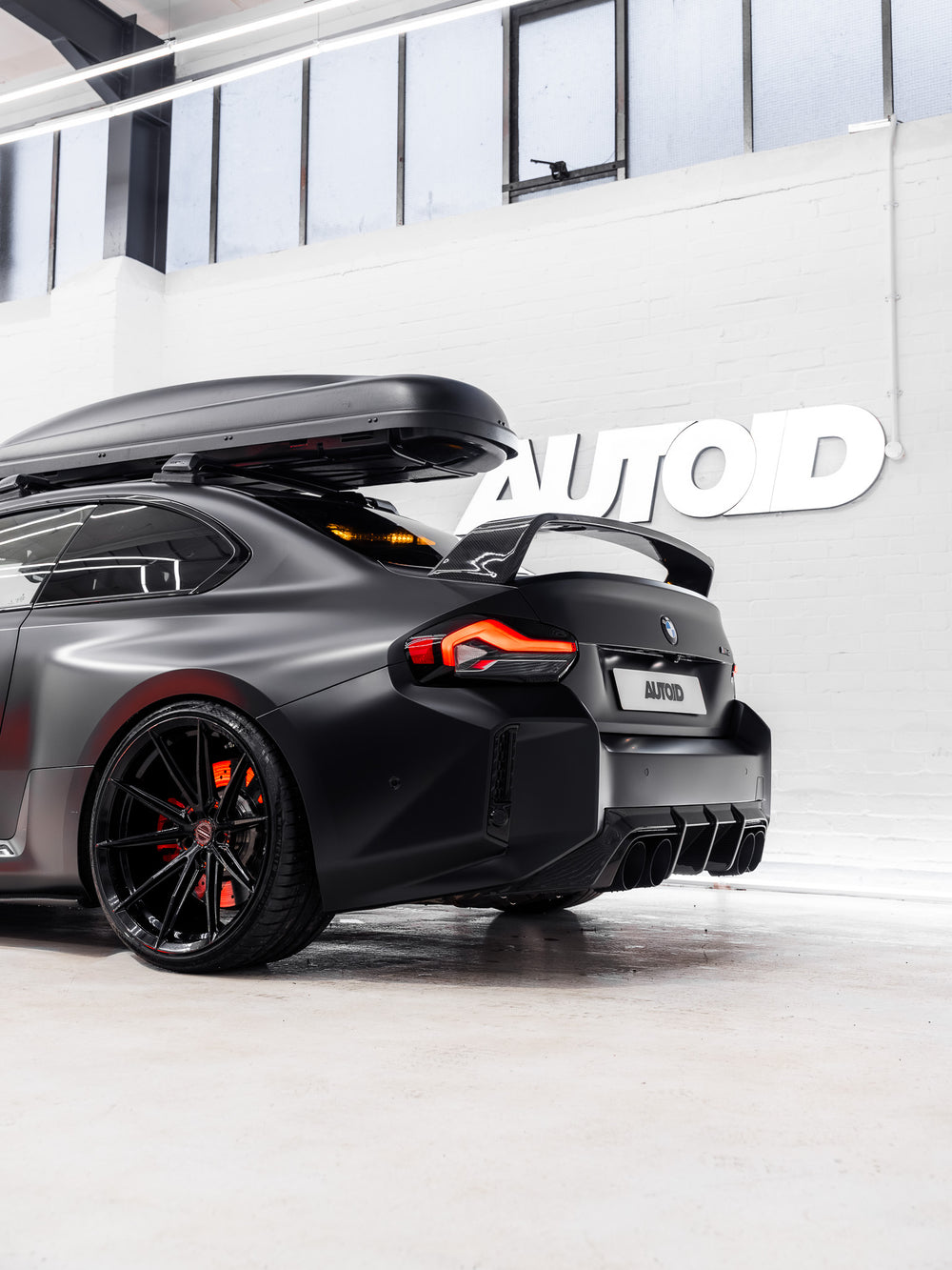 BMW M2 G87 rear diffuser by TREVORA, made of pre-preg carbon fibre, showcasing sleek, aerodynamic design on a 2023 model.