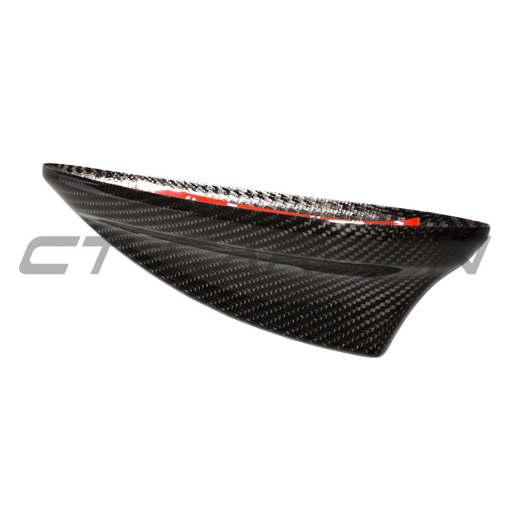 BMW Fxx carbon fibre antenna cover by CT Carbon, close-up view showing sleek black textured finish and precise fit for vehicle accessories.