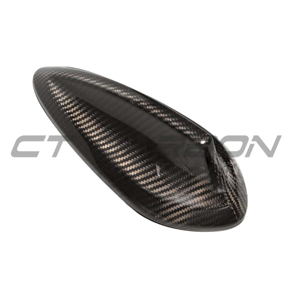 BMW Fxx carbon fibre antenna cover by CT Carbon, close-up of sleek, textured carbon fibre accessory on vehicle antenna.