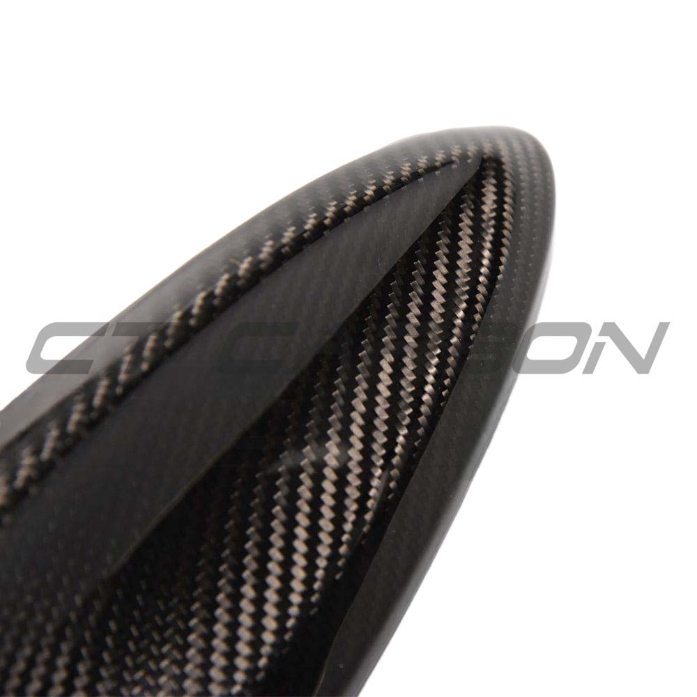 BMW Fxx carbon fibre antenna cover by CT Carbon, close-up view showing sleek black textured finish and precise fit for antenna.