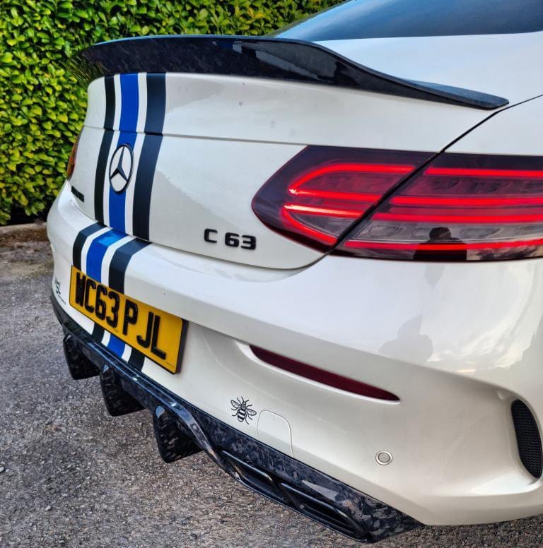 Mercedes C63/C63S W205 Coupe forged carbon fiber diffuser with big fin by CT Carbon, showcasing sleek aerodynamic design and craftsmanship.
