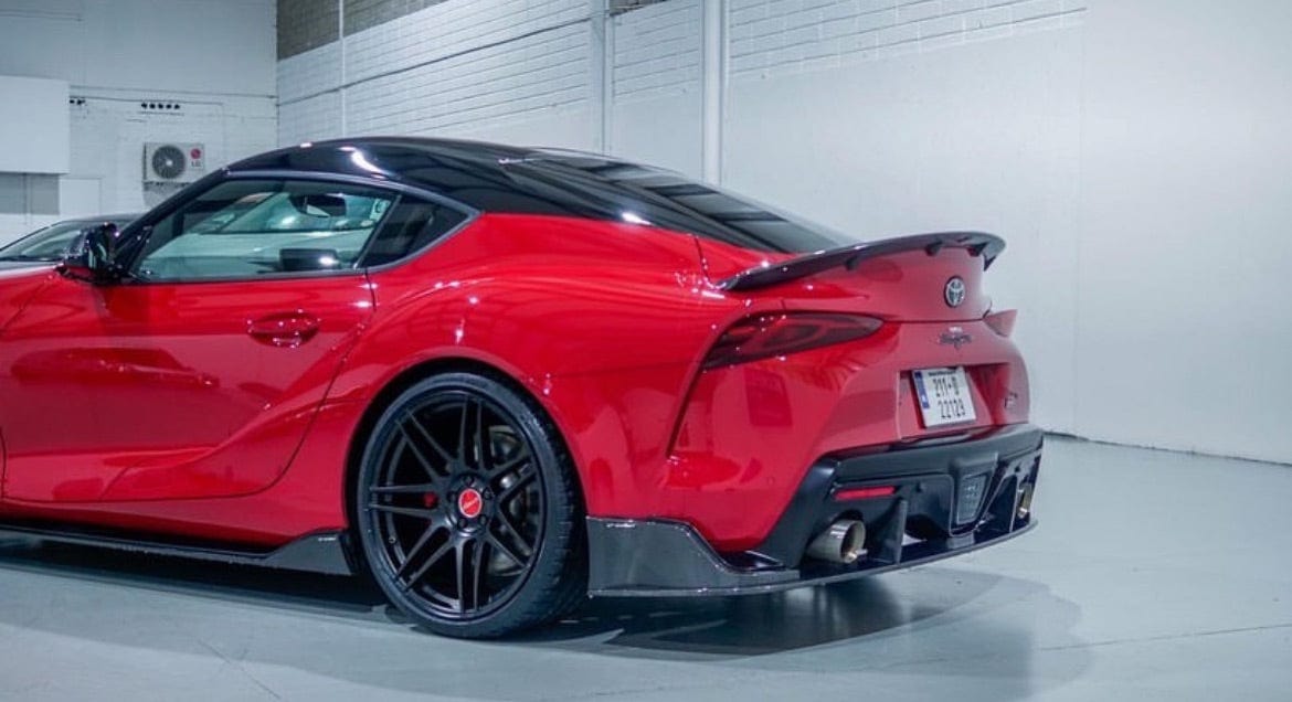 Toyota Supra 2019+ A90 CT Carbon carbon fiber diffuser, showcasing sleek aerodynamic design and high-quality craftsmanship.