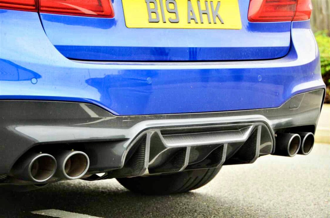 BMW F90 M5 saloon with CT Carbon full carbon fiber kit, showcasing sleek, lightweight carbon fiber components on the car's exterior.