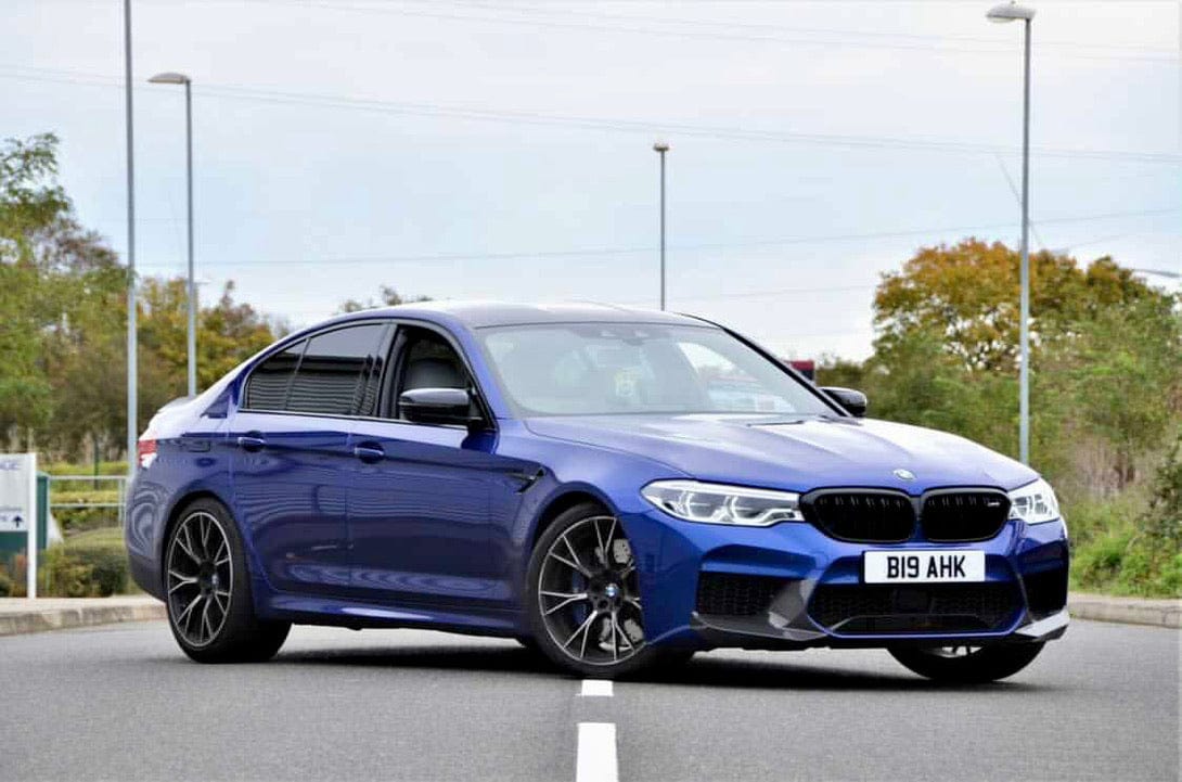 BMW F90 M5 saloon with CT Carbon full carbon fibre kit, showing sleek, lightweight carbon fiber body accents and aerodynamic details.