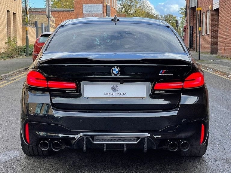 Full BMW F90 M5 saloon with CT Carbon full carbon fiber kit, featuring sleek carbon fiber accents on the car's exterior.