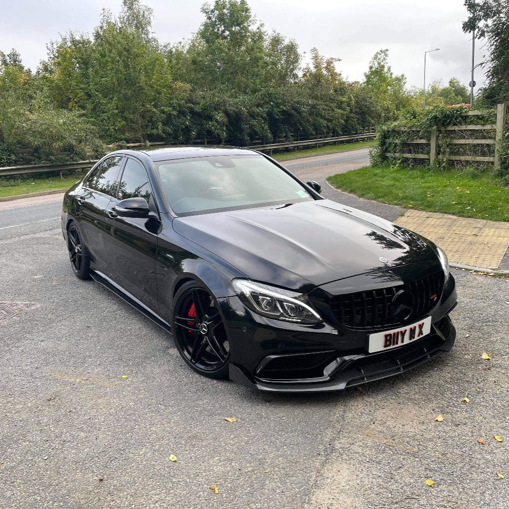 Full carbon fibre kit for Mercedes C63 W205 saloon by CT Carbon, includes front and rear bumper parts with a sleek carbon finish.