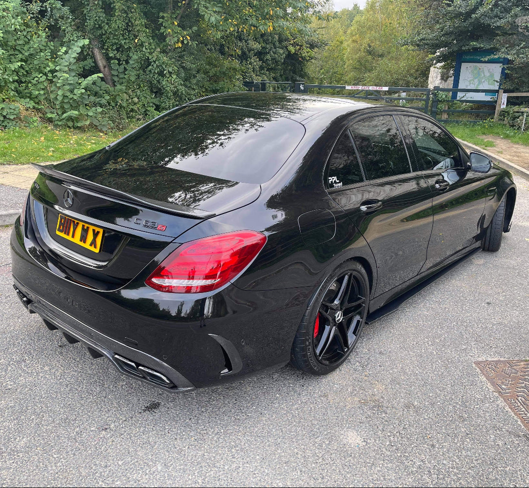 Full carbon fiber kit for Mercedes C63 W205 saloon by CT Carbon, includes body panels and accents with a sleek carbon fiber finish.