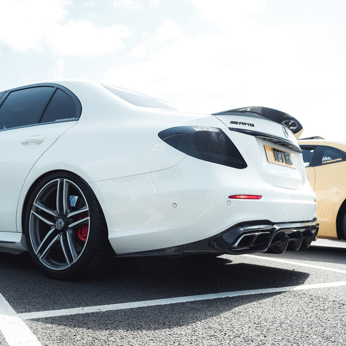 Mercedes E63 W213 2018-2020 CT Carbon fiber spoiler showing sleek aerodynamic design and glossy finish on a sports car.