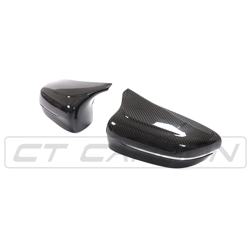 BMW F90 M5 M5C Competition carbon fibre mirror overlay by CT Carbon, RHD, showcasing sleek, textured mirror covers.