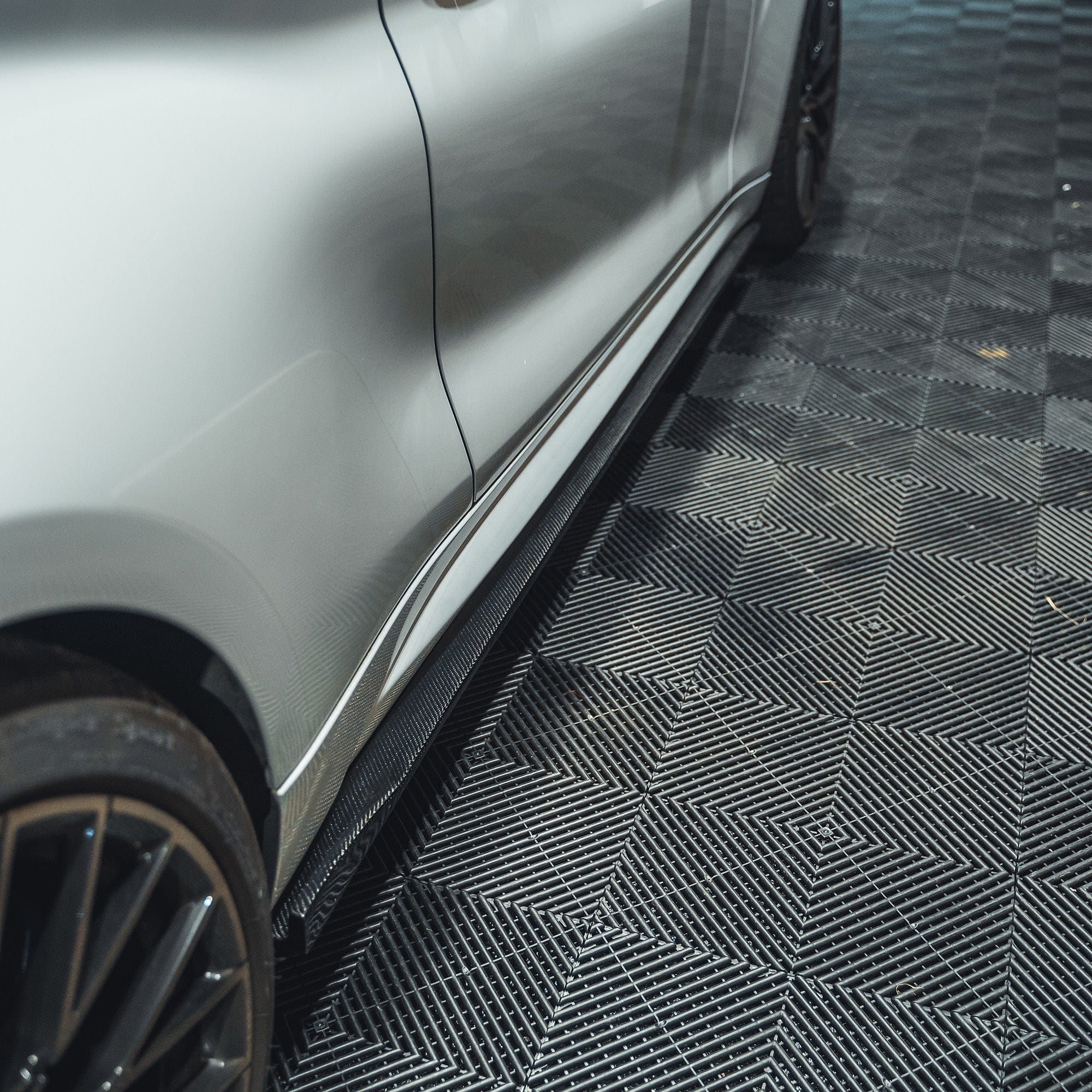 BMW M2 F87 carbon fibre side skirts by CT Carbon, featuring a 3D design for enhanced sporty appearance and aerodynamic performance.