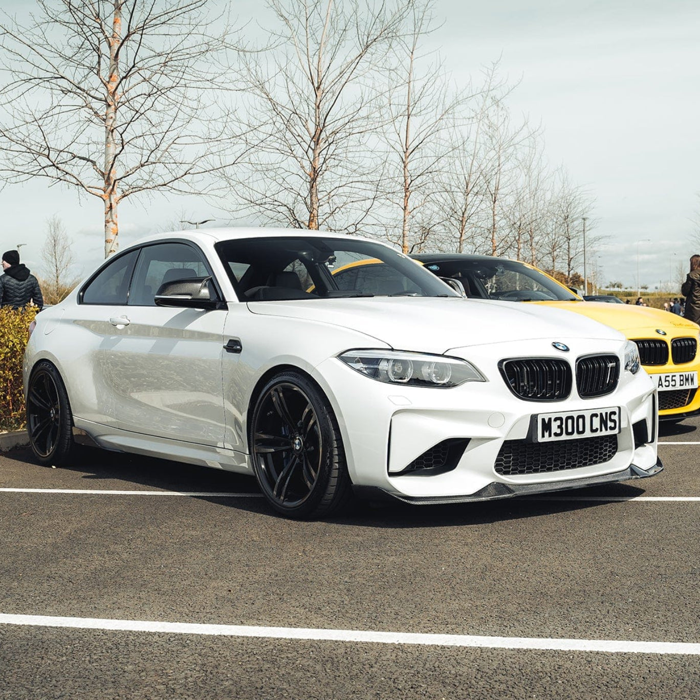 BMW M2 F87 carbon fiber splitter by CT Carbon, V6 style, showcasing the sleek, textured carbon fiber finish on the front splitter.