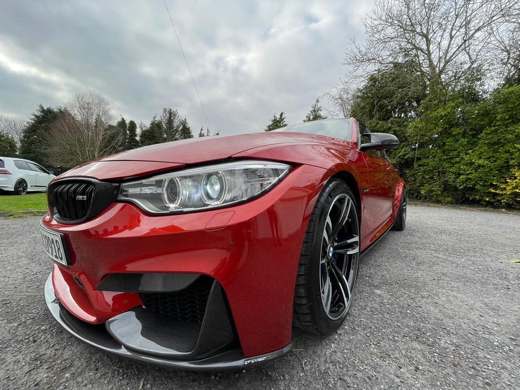 BMW M3 F80 full carbon fibre kit by CT Carbon, including splitter and body panels, showcasing a sleek, lightweight design.