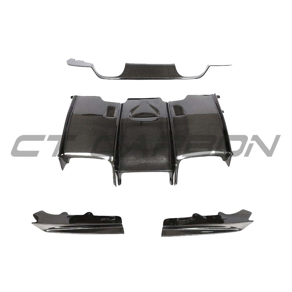 BMW M3 M4 F80 F82 F83 carbon fiber diffuser by CT Carbon, showing the sleek, lightweight design and textured carbon fiber surface.