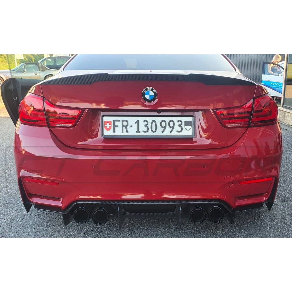BMW M3 M4 F80 F82 F83 carbon fibre diffuser by CT Carbon showing sleek, lightweight design with textured carbon fiber surface.