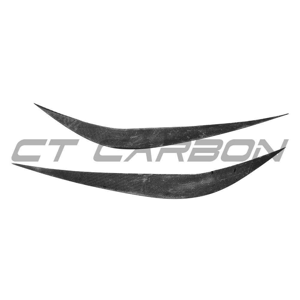 BMW M3 M4 F80 F82 F83 carbon fibre eye lids accessories from CT Carbon, showing sleek black carbon fibre eye lid covers on vehicle.
