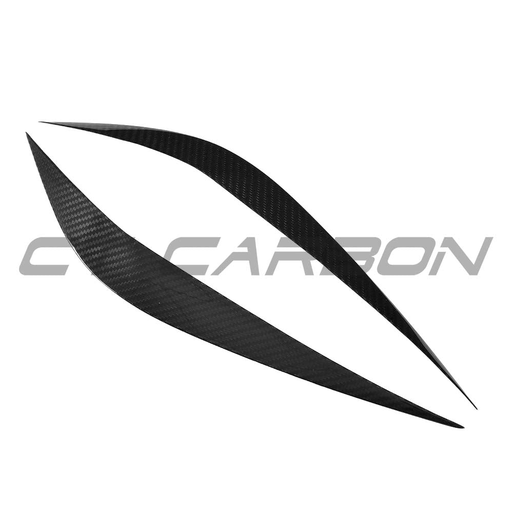 BMW M3 M4 F80 F82 F83 carbon fiber eye lids accessories by CT Carbon, showcasing sleek, textured carbon fiber eye lid design.