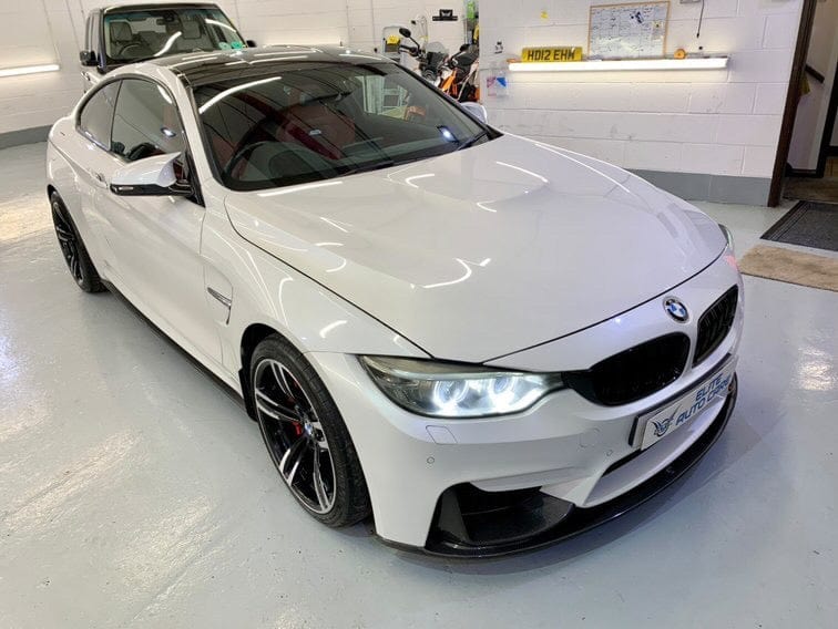 Full view of a BMW F82 M4 Coupe 2014-2020 with CT Carbon full carbon fiber kit, including splitters and aerodynamic enhancements.