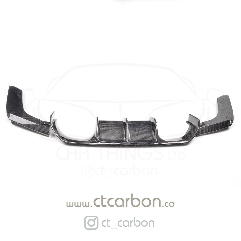 Full BMW M4 F83 convertible carbon fibre kit by CT Carbon, featuring splitter and V-style aerodynamic parts on the car.