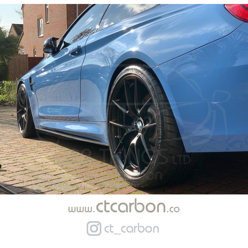 Full view of a BMW M4 F83 convertible with CT Carbon full carbon fibre V-style kit, showcasing carbon fibre splitter and body accents.