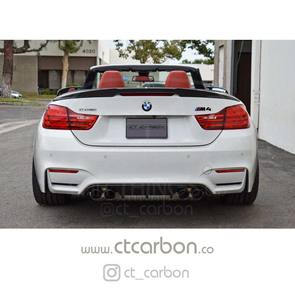 Full BMW M4 F83 convertible with CT Carbon V-style full carbon fiber kit, including splitter, showcasing sleek carbon fiber details.