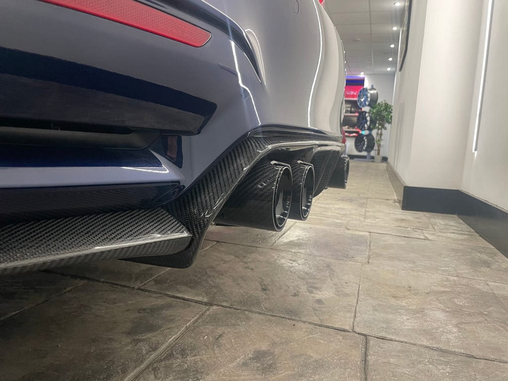 BMW M4 F83 convertible with CT Carbon full carbon fiber kit, showing the splitter and aerodynamic enhancements.