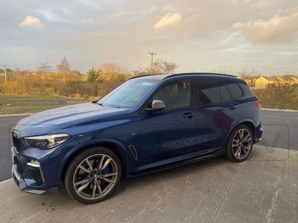 BMW X5 G05 CT Design carbon fibre splitter, a sleek aerodynamic car accessory with a textured carbon fiber finish.