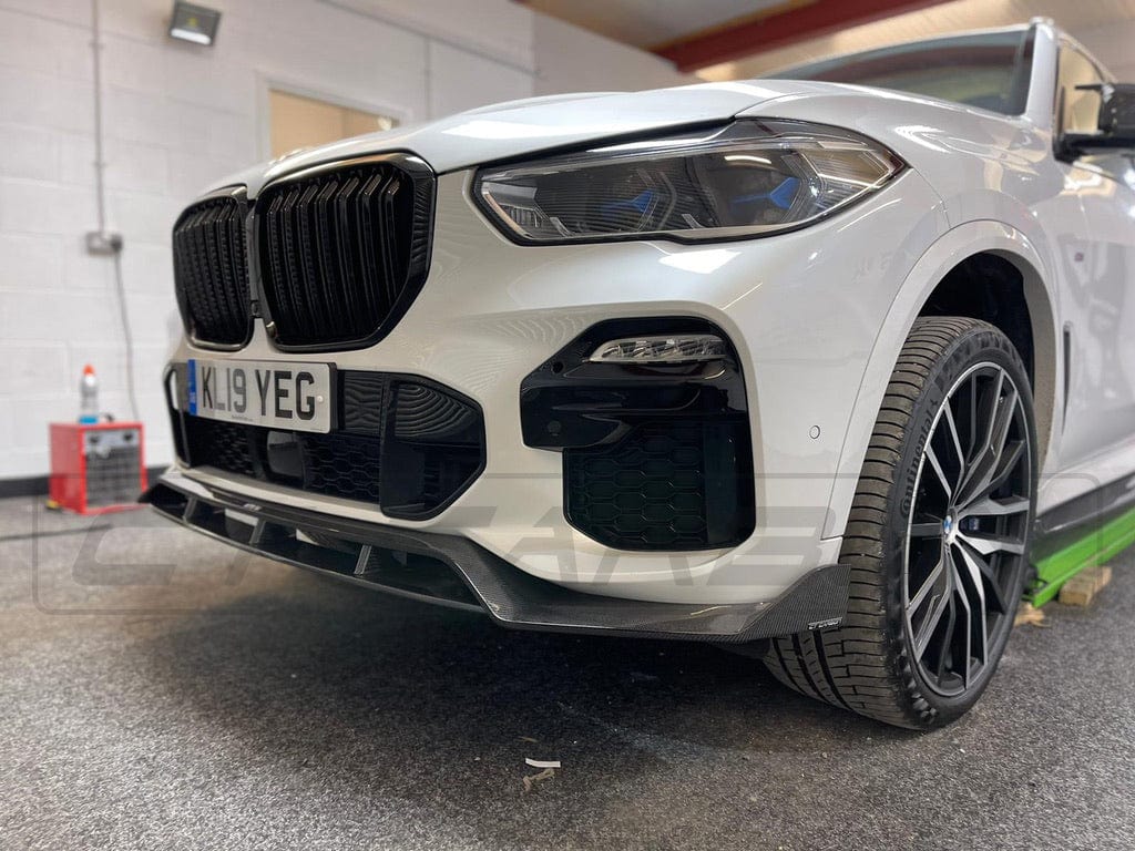 BMW X5 G05 CT Design carbon fibre splitter, a sleek aerodynamic car part with a textured carbon fibre finish.