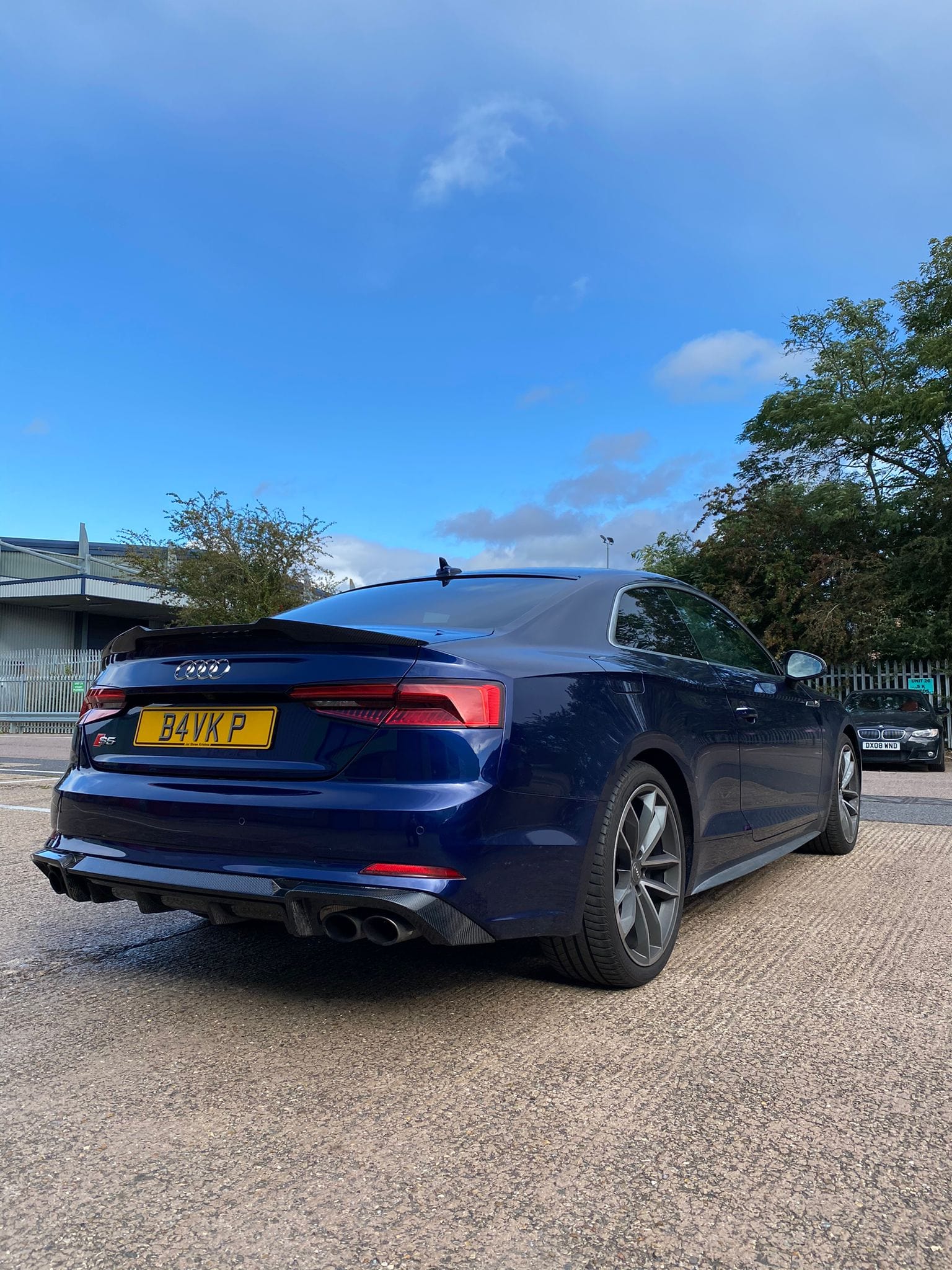 Carbon fibre spoiler for Audi A5/S5 B9 Coupe 2017-2021 by CT Carbon, showcasing sleek V-style design on the vehicle's rear.