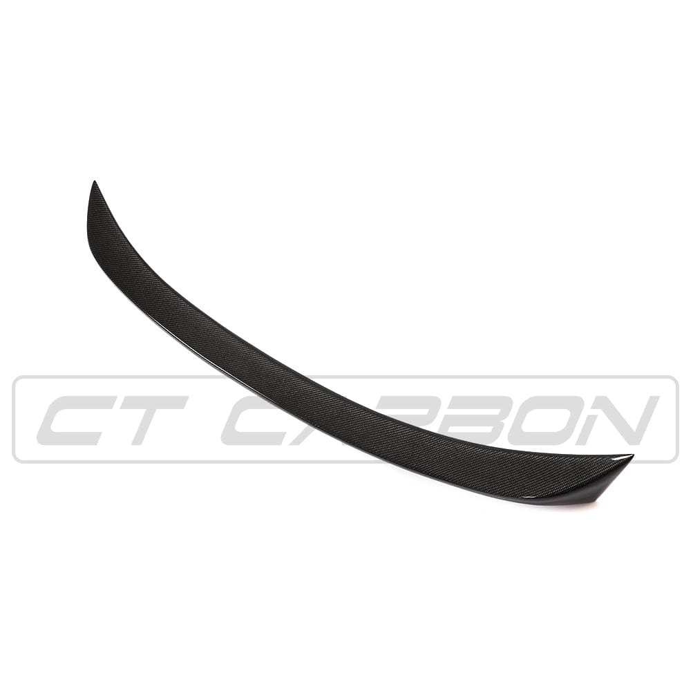 BMW F10 M5 carbon fibre spoiler by CT Carbon, V-style design, showcasing sleek aerodynamic features on the car's rear.